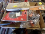 Box with snips, New Circular Saw Blade, Quick Stix Firewood Log Guide, and
