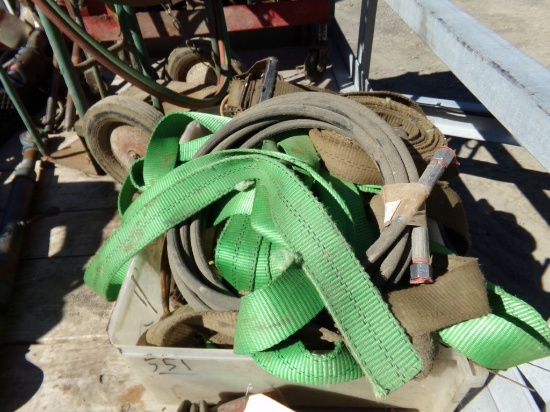 Clear Tote Full of Straps and a Small Hydraulic Hose
