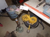 Sump Pump and Bucket of Cords and Hoses