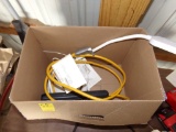 Box with Short Extension Cords and Power Splitters with a Desk Lamp
