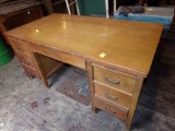 Oak Colored Wooden Desk, Center drawer, 6 Side Drawers and 2 Slide Out Work