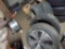 Loose Tires and Wheels on Floor, (4) are Mounted, (1) Loose Aluminum Wheel