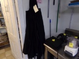 Group of Black Aprons on Wall by Storage Room Door (Back Room)