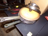(4) Frying Pans With a Couple Lids (Dining Room)