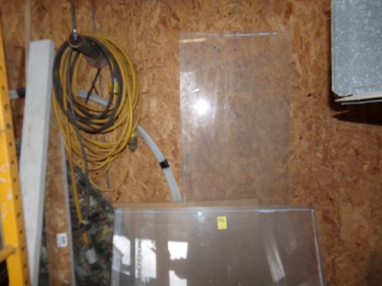 Group of Extension Cords, Plexiglas, Pllastic Hose and Loose Wood Against B