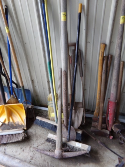Pick, Brooms, Shovels, 3 Prong Fork, and a Scoop (Lean to Side of Garage)