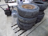 (4) Used 215/85 R16 Light Truck Tires and (1) Odd 16'' Spare on a Rusty Ste