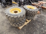 Set of (4) Heavy Duty Galaxy 12x16.5 Skid Steer Tires on Yellow 8 Lug Wheel