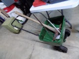 Scotts Walk Behind Spreader/Seeder with a Pick Axe and Hand Saw
