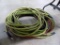 Green and Red Air Hoses Under the Table