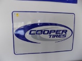 Cooper Tires Tin Sign on Wall in Showroom