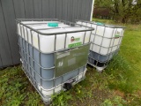 (2) Caged Poly Tanks of Beet Juice for Loading Tractor Tires: (1) is Nearly