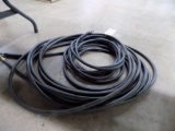 (2) Black Air Hoses Under the Table