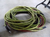 Green and Red Air Hoses Under the Table