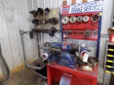 Ammco Brake Lathe with Tooling on the Wall Behind It