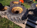 (2) Used 12-16.5 12 Ply Skid Steer Tires on 8 Lug Rims