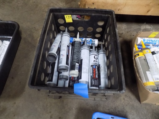Black Crate Full of Silicone Sealant