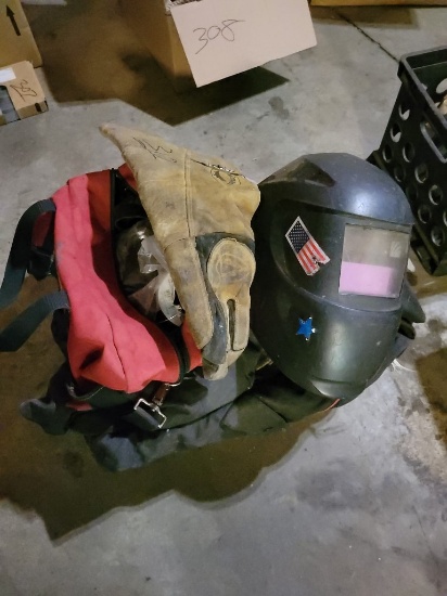 Box With Welding Gloves, Helmet, Clamps, And Other Related Items