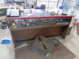 6' x 30'' Glass Front Service Counter with Wooden Counter Top Sitting on To