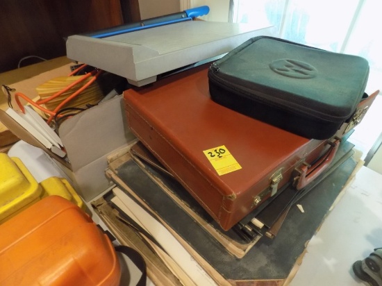 Brown Briefcase with Walkie Talkies and Stack of Local Atlas' of Surroundin