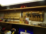 Group of Chisels and Wood Planing/Making Tools on Wall Under Light, Putty K