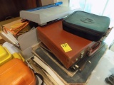 Brown Briefcase with Walkie Talkies and Stack of Local Atlas' of Surroundin