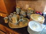Group of Tacy Porter Painted Ceramic Dishes on Counter, ''The Laurel Leaf C