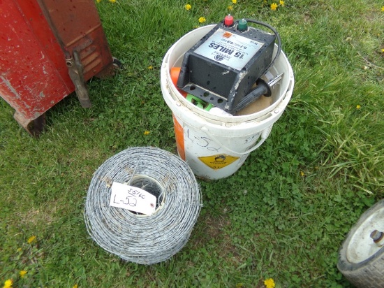 Bucket with Misc. Fence Supplies and a Roll of Barbed Wire (5160)