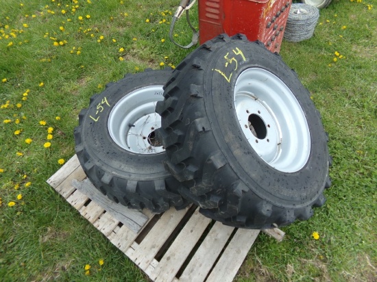 (2) New Carlisle 12-16.5 NHS Tires Mounted on Gray 6 Lug Wheels (2 X Bid Pr