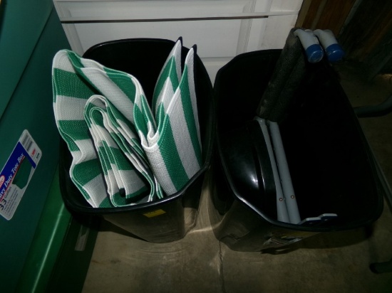 (2) Black Garbage Cans, (2) Overhead Tool Hangers and a Green and White Nyl