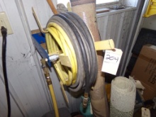 Air Hose Reel on Wall Above Compressor