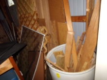 Plastic Barrel with Scrap Wood and Scrap Panel Wood Next to It