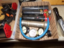 Box with AC Recharge Adapter, Some Gauges and Flashlights