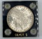 1890 Morgan Silver Dollar in Capital holder. AU