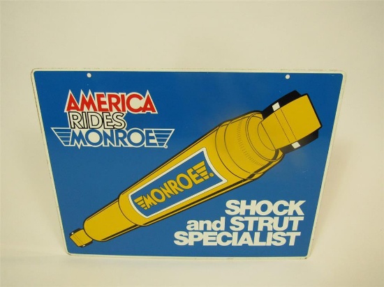 Vintage Monroe Shock Absorbers America Rides Monroe double-sided tin automotive garage sign.