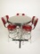 Neat set of three 1950s-style chrome soda fountain stools with period high-top table.