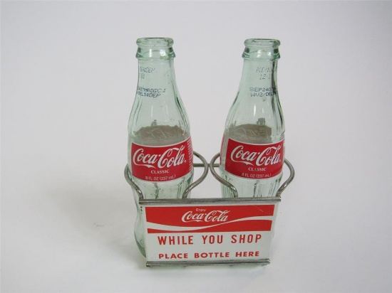 Uncommon early 1960s Coca-Cola Enjoy While You Shop shopping cart bottle holder.