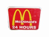 McDonalds highway road sign with Golden Arch logo.