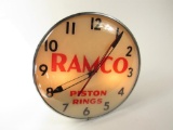 Nice 1940s-50s Ramco Piston Rings glass-faced light-up automotive garage clock.