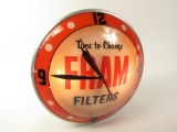 Choice late 1950s Fram Oil Filters glass-faced light-up double-bubble service station clock.