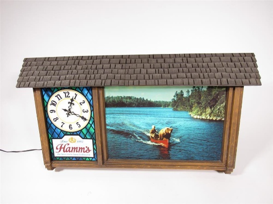 Outstanding 1960s Hamms Beer light-up chalet sign/clock with bear in canoe artwork.