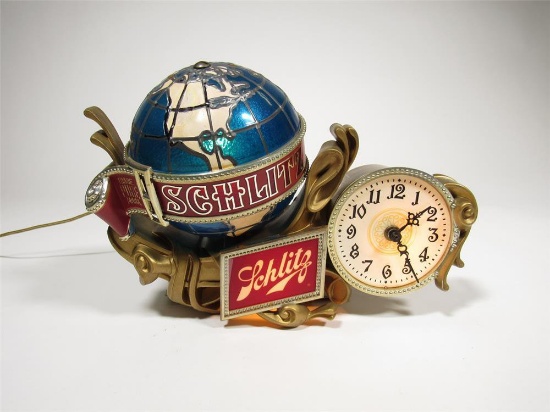 Wonderful 1960s Schlitz Beer light-up rotating globe bar-back tavern sign with clock.