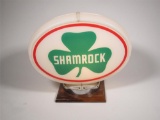 Excellent NOS Shamrock Gasoline oval-shaped gas pump globe in a Capcolite body.