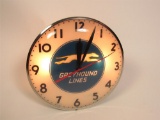 Scarce 1940s Greyhound Lines glass-faced light-up bus terminal clock with Greyhound logo.