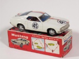 Killer 1969 Ford Racing Mustang battery-operated tin litho car still in the original box.