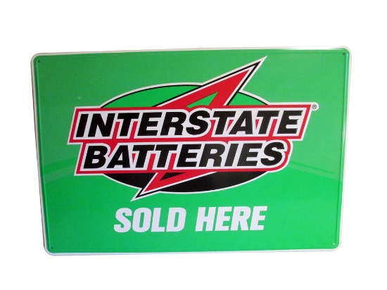 NOS INTERSTATE BATTERIES SOLD HERE EMBOSSED TIN SIGN.