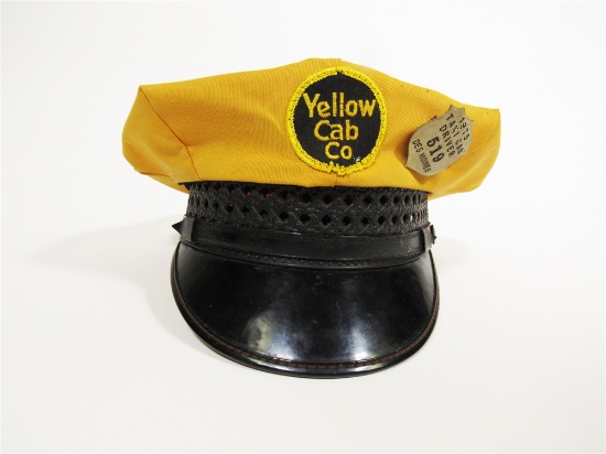 CIRCA LATE 1960S YELLOW CAB COMPANY DRIVERS HAT WITH A 1975 TAXI CAB DRIVER PERMIT SHIELD FROM CITY 