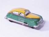 1950S COURTLAND TIN LITHO WIND-UP CHECKERED CAB