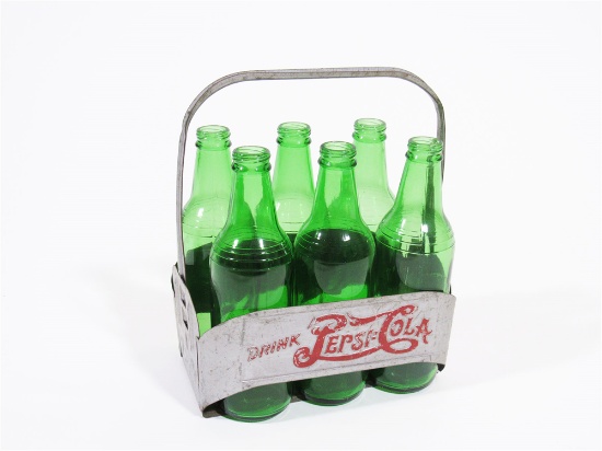 CIRCA 1940S PEPSI-COLA EMBOSSED SIX-PACK BOTTLE CARRIER AND BOTTLES