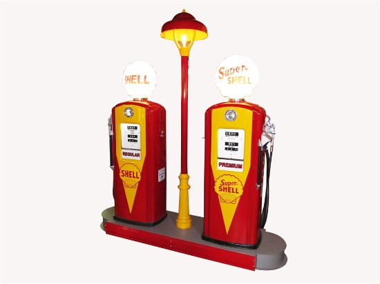 1950S SHELL OIL FUEL ISLAND WITH TWO TOKHEIM 300 GAS PUMPS